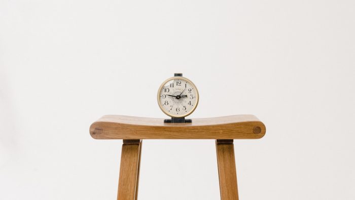 brown wooden table clock at 10 10