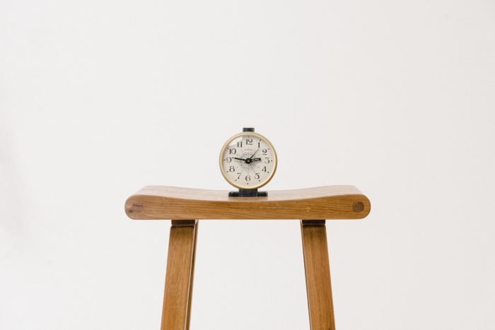 brown wooden table clock at 10 10