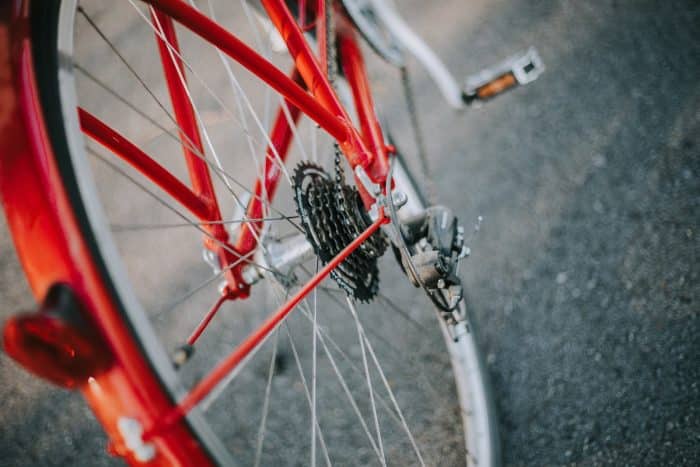 selective focus photography of red and gray bicycle