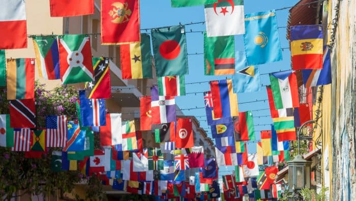 a wall with many flags from it